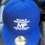 Blue baseball cap with 'World Renowned Motown' embroidery.