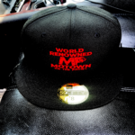 Black cap with red text and a gold sticker on the brim.